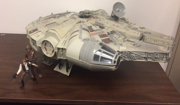 A model of the Millennium Falcon with Han Solo and Chewbacca figures.