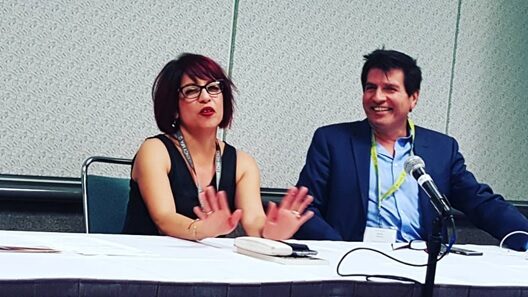 An image of Michelle Gonzales speaking on a panel.