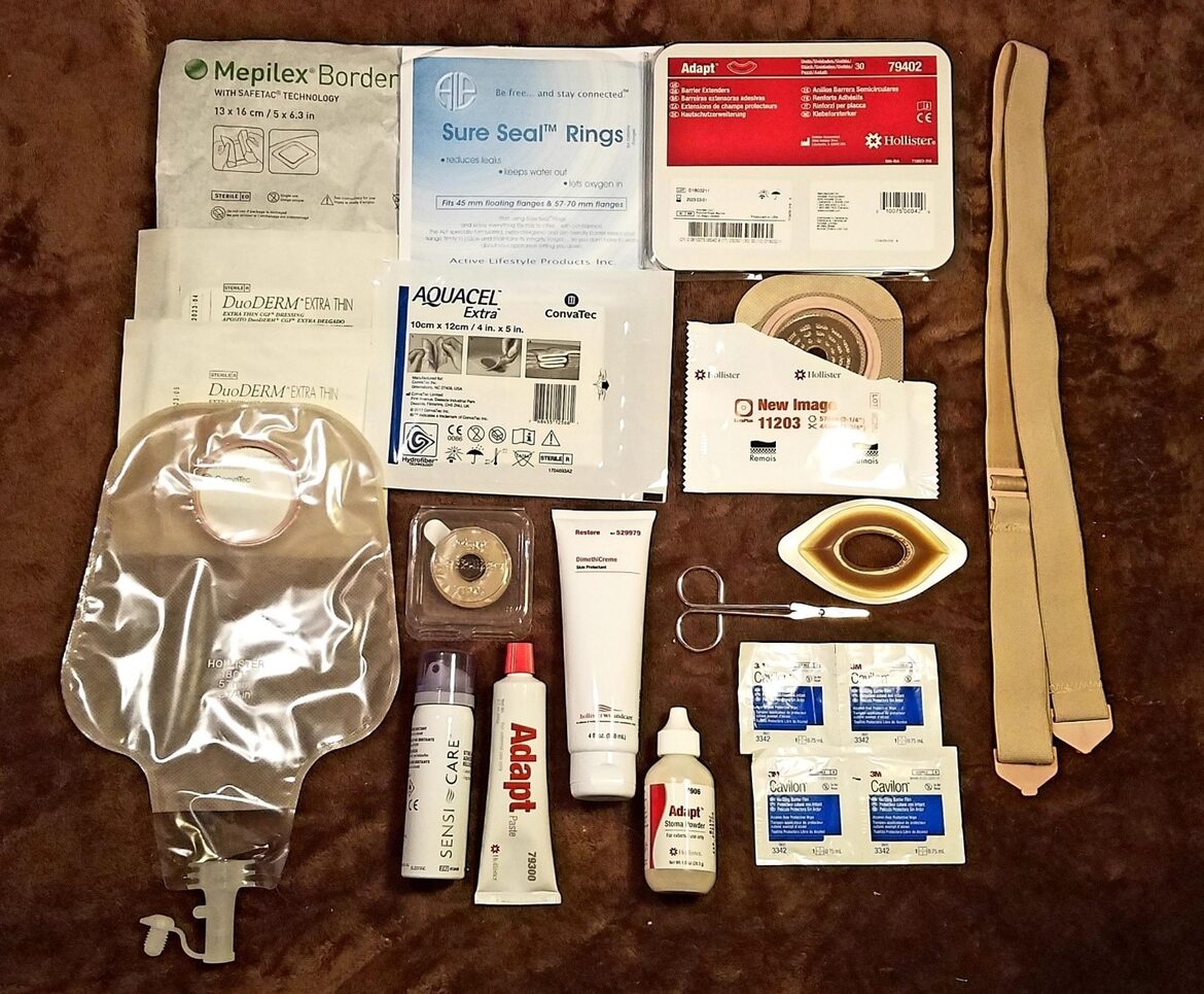 Ostomy supplies laid out against a backdrop.